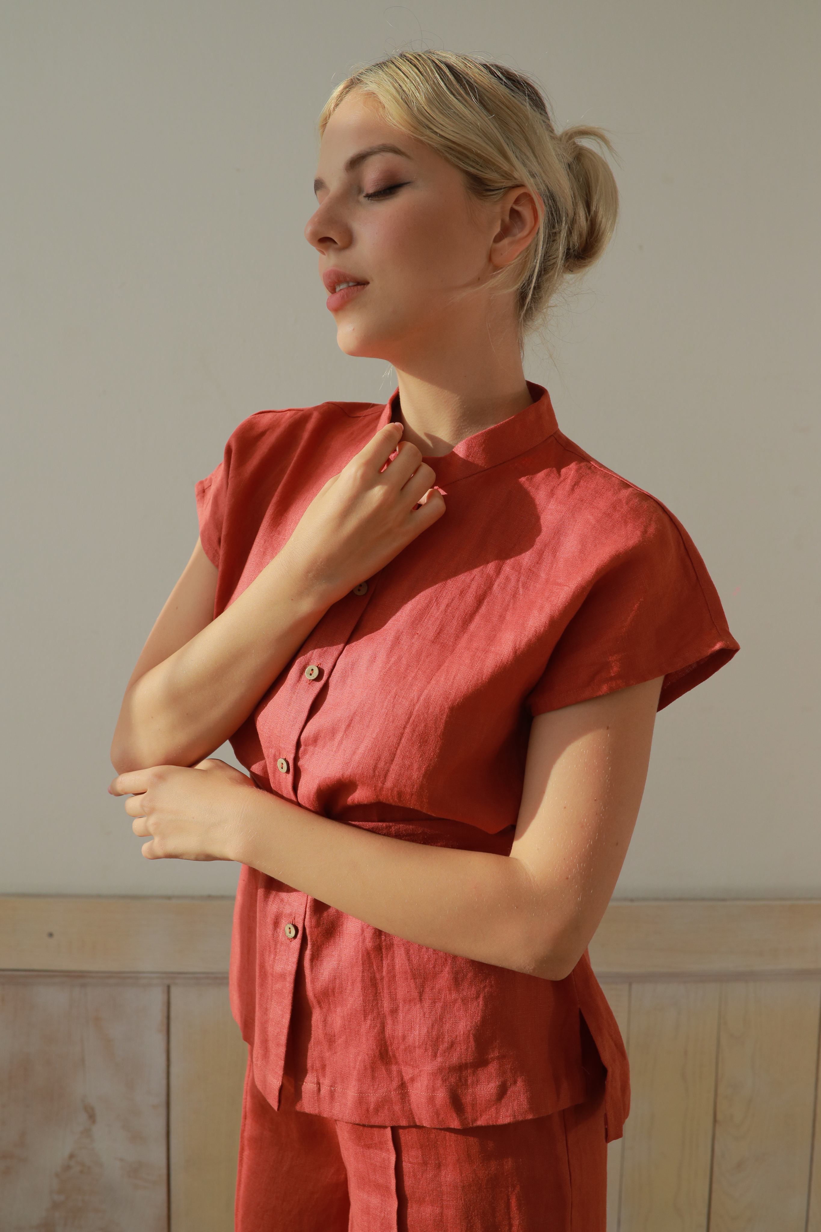 Woman wearing an outfit against a neutral background