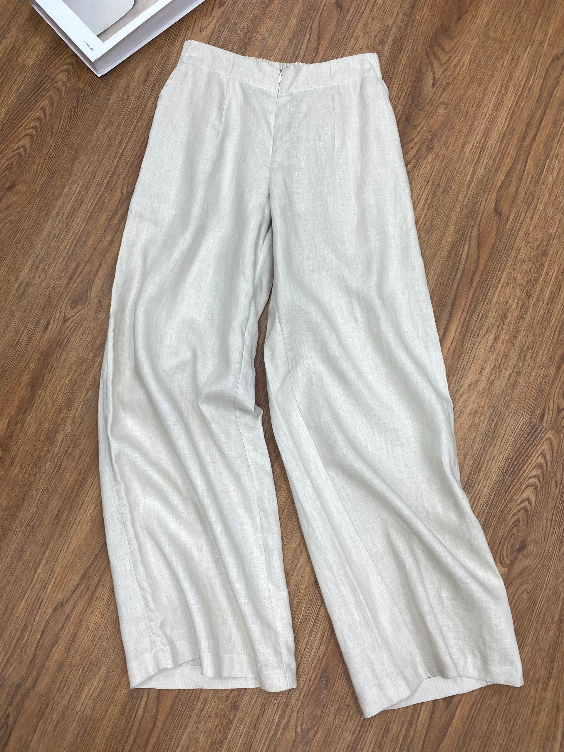 White pants on a wooden floor