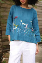 Hand-embroidered linen blouse
