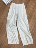 White pants on a wooden floor