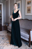 Emerald green velvet evening gown