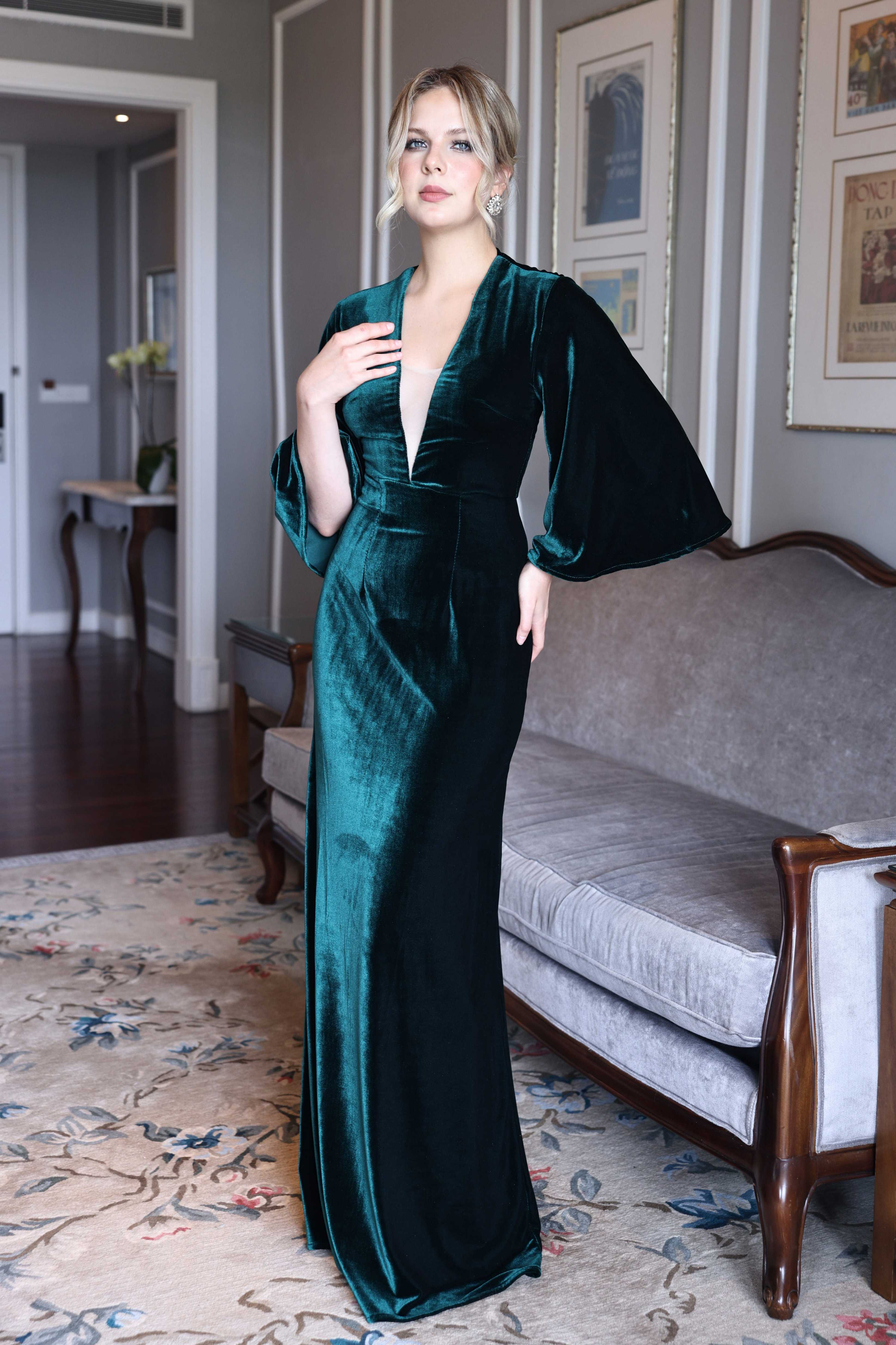 Emerald velvet gown with bell sleeves
